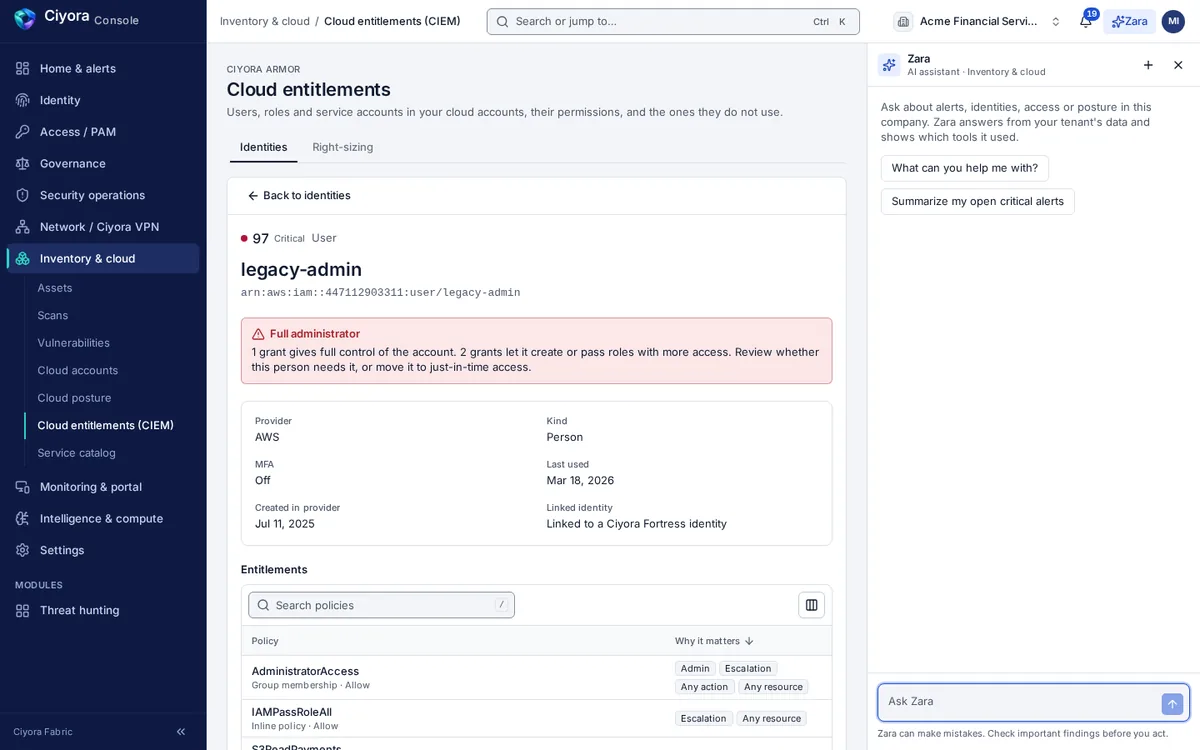 A cloud identity in Ciyora Armor: a legacy AWS administrator user with a critical privilege score, a warning that it has full control of the account and can pass roles, MFA off, and the policies that grant it.